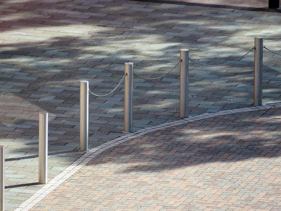 Stainless steel street bollards linked by chain