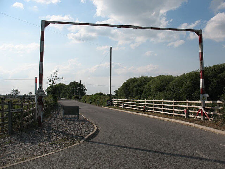 Goalpost height restriction barrier over a site road