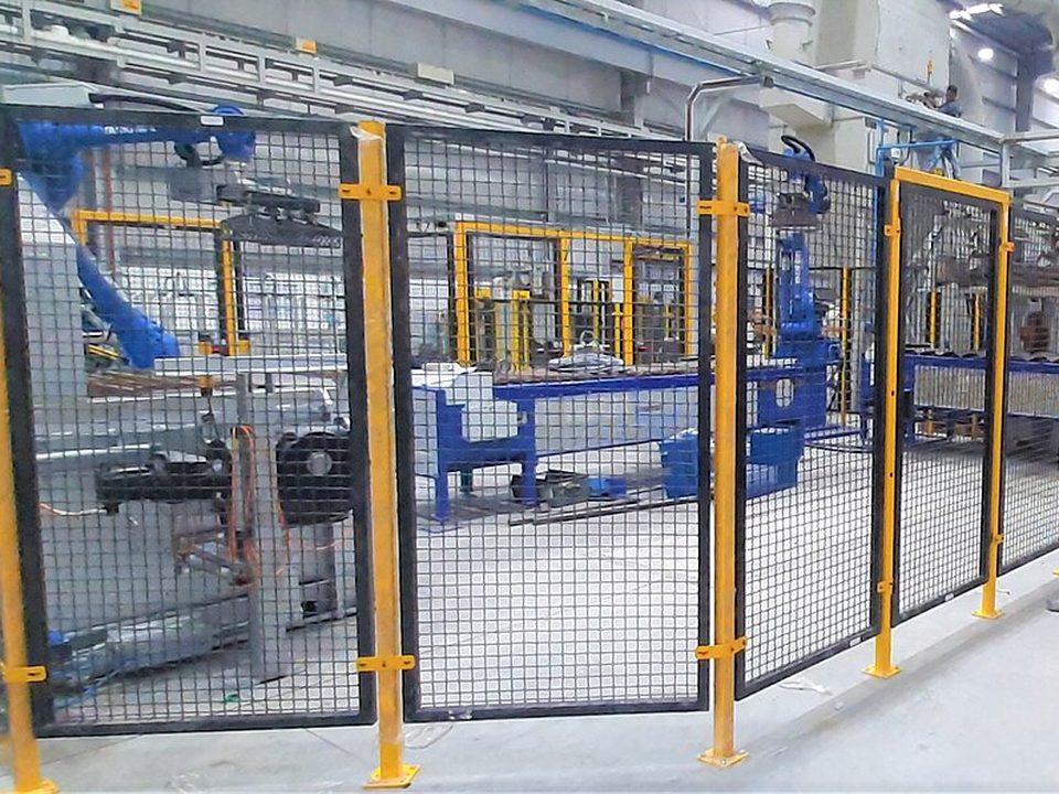 Mesh machine guarding panels around a production cell